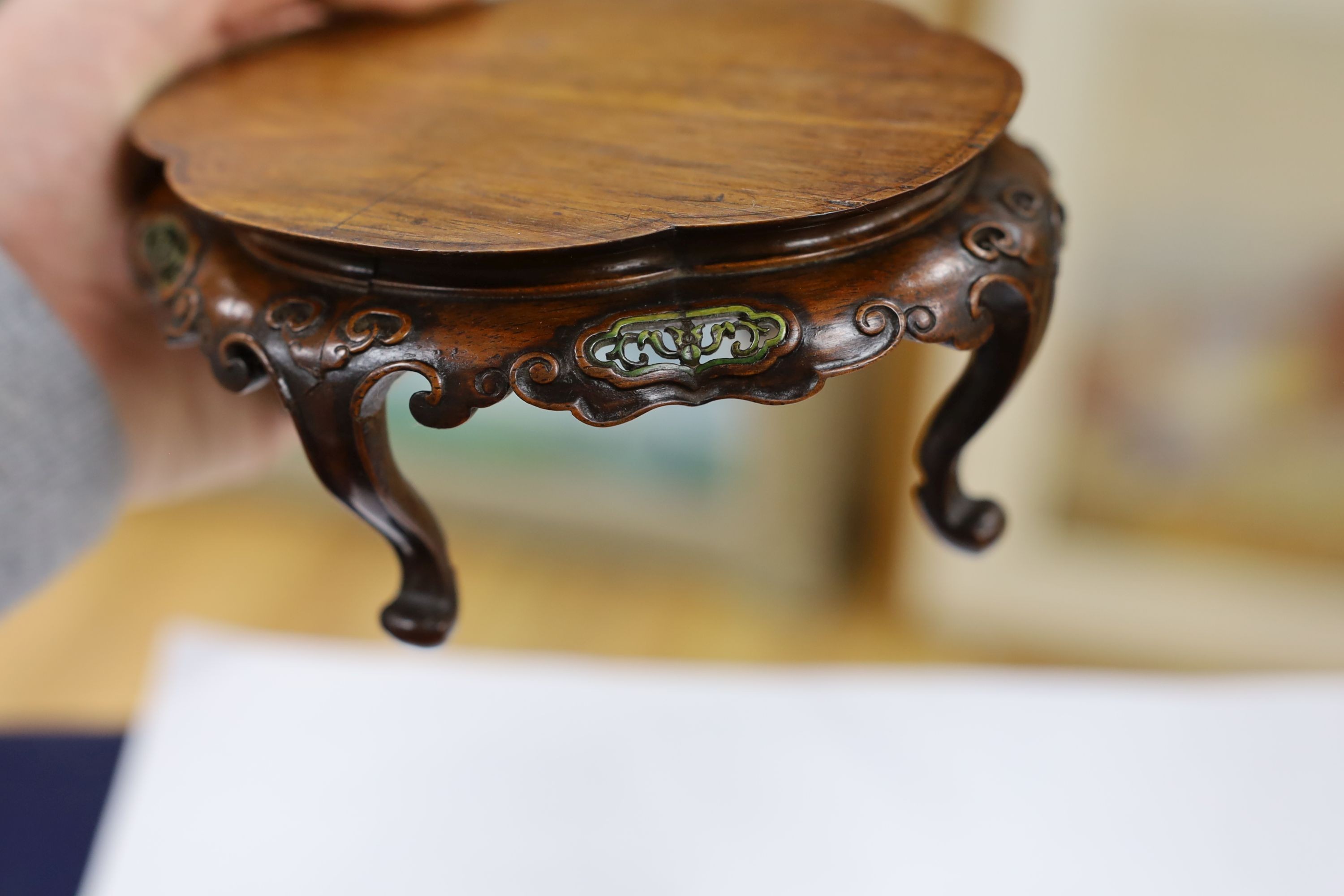 A fine Chinese oval hardwood and green stained Ivory inset stand, Qing dynasty, lacking stretcher, 15 cms wide.